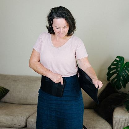 Woman adjusting the back cuff to suit