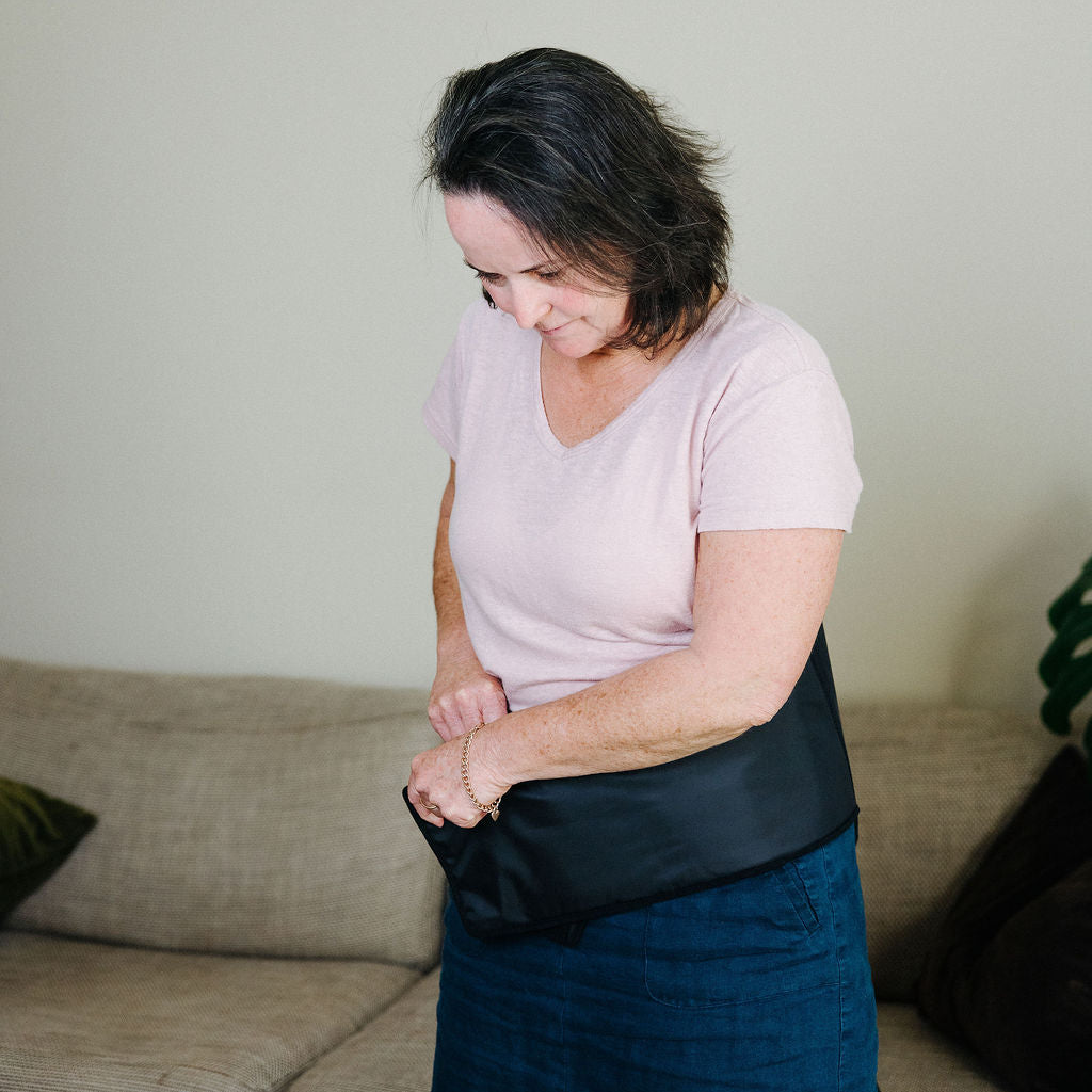 Woman tightening back cuff